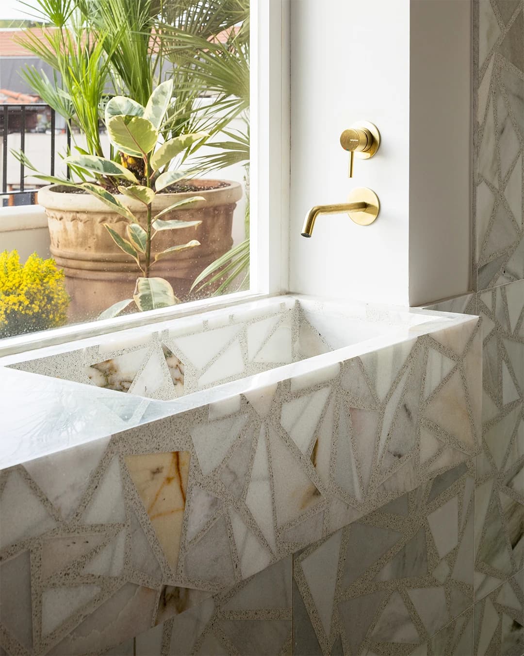 Terrazzo bathroom: custom-made basin and shower walls.